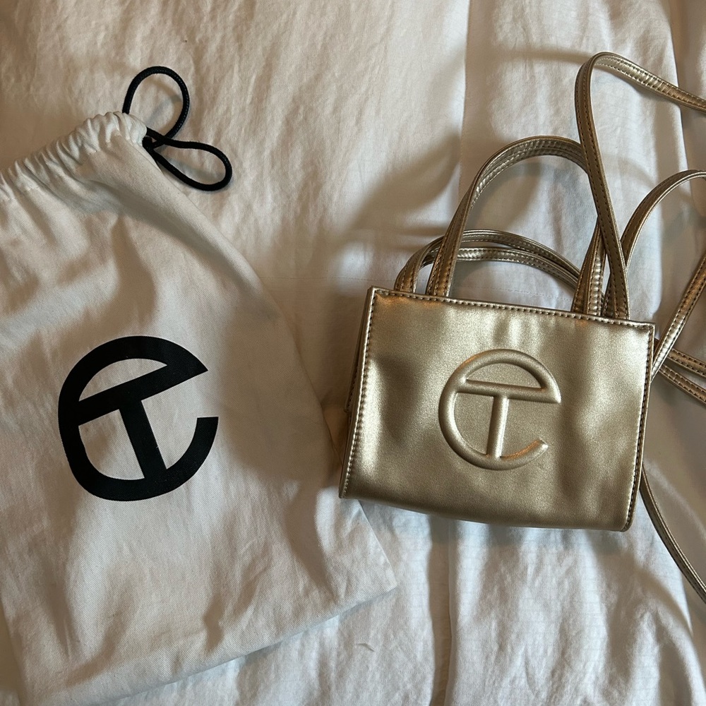 Gold small Telfar bag.
